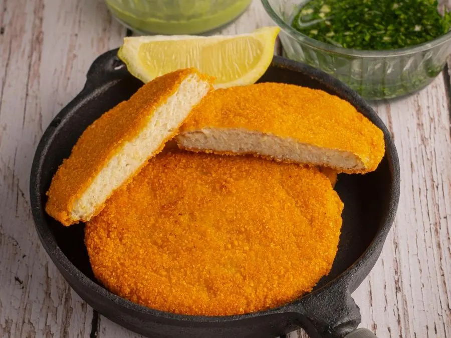 Breaded pre-fried hake medallions